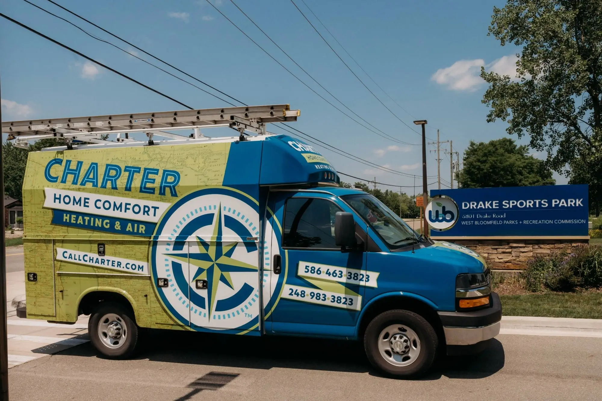 Charter Home Comfort van parked in front Drake sports Park In West Bloomfield Michigan  